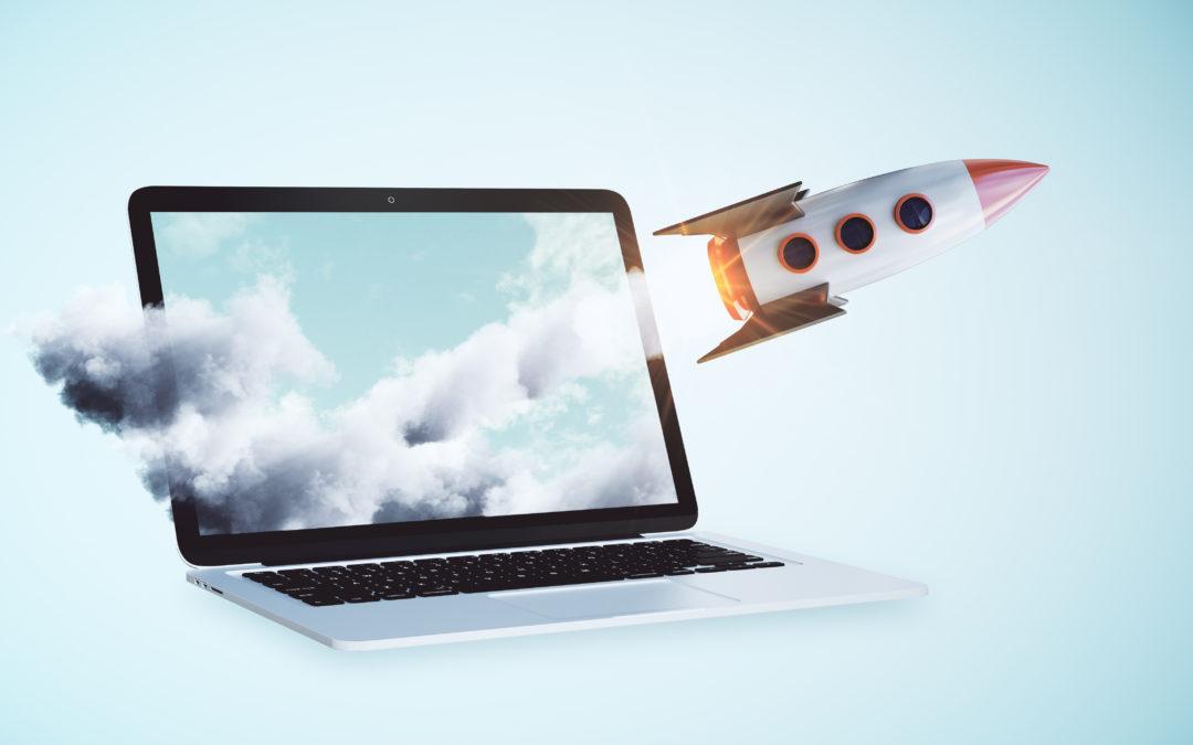 A rocket launching out of a laptop to show increased sales